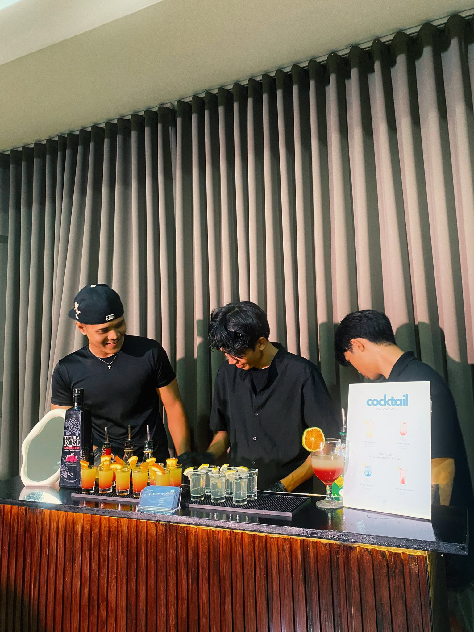 Bartenders serving